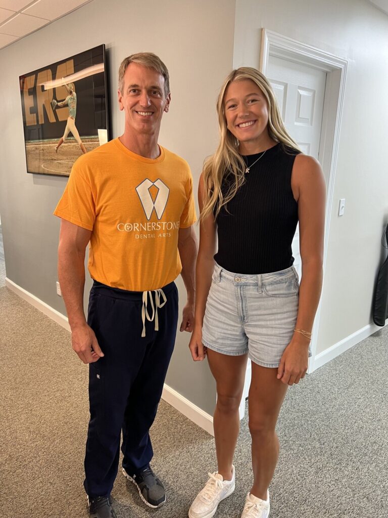 Dr. Jody F. Griffin in Cornerstone Dental Arts shirt smiling with a young female team member at the Knoxville TN office