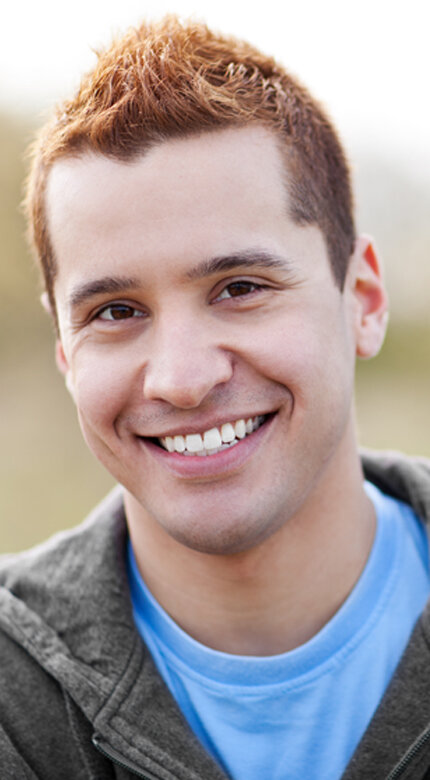 Young man smiling outdoors - Cornerstone Dental Arts smile gallery Knoxville TN