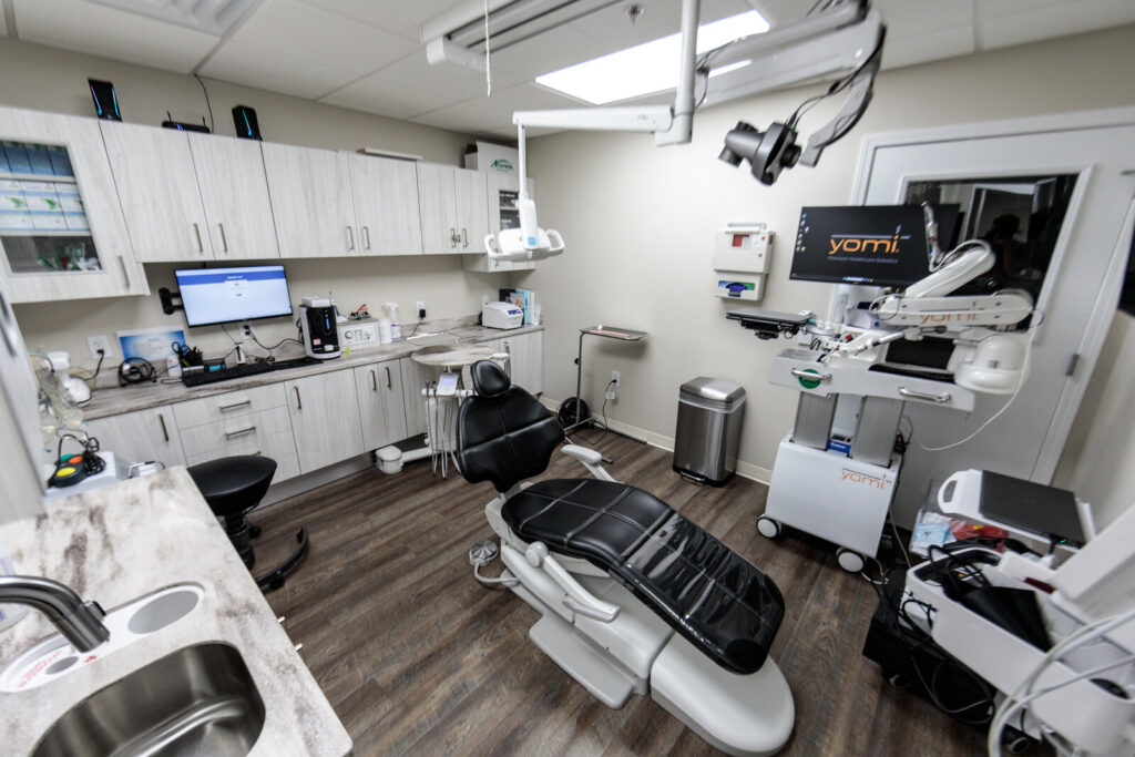 Wide view of a Cornerstone Dental Arts treatment room with Yomi robot in Knoxville, TN.