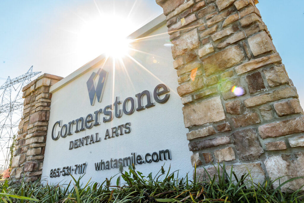 Cornerstone Dental Arts stone monument sign with sun flare at the Town and Country office in Knoxville, TN