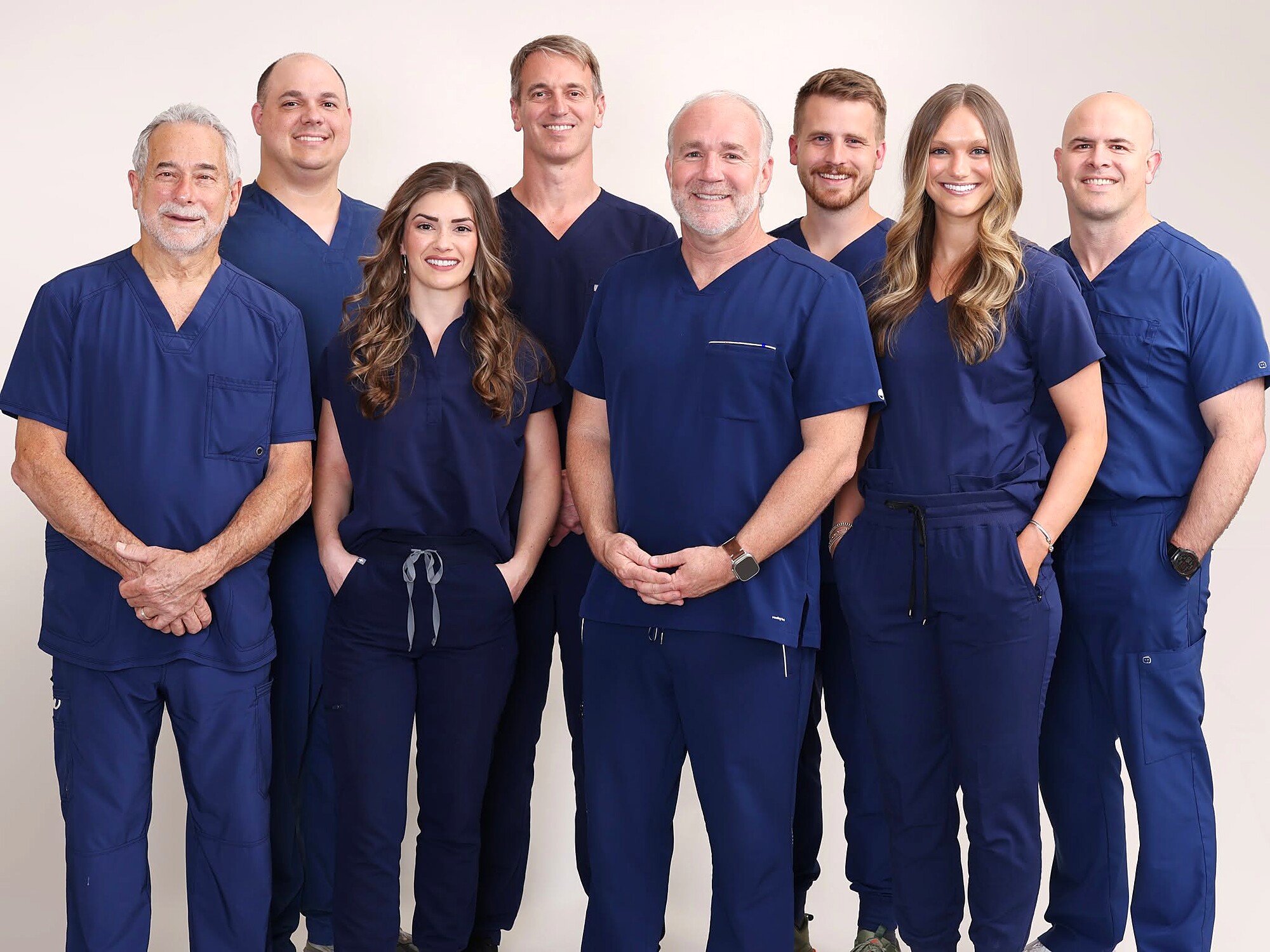 The eight doctors of Cornerstone Dental Arts in scrubs, Knoxville, TN
